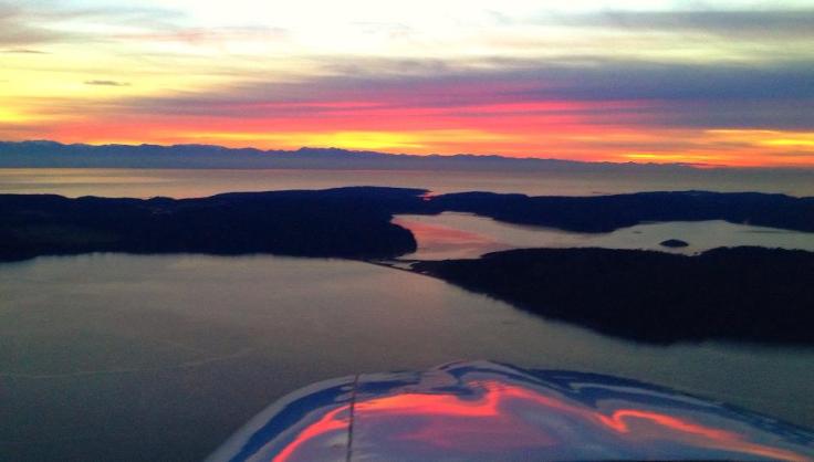 "Nine Minutes After Sundown." Photo from 1,500' over Decatur Island, looking to the Southwest, Lopez Island, and the Olympic Peninsula. Photo by Jeffery A. Lustick